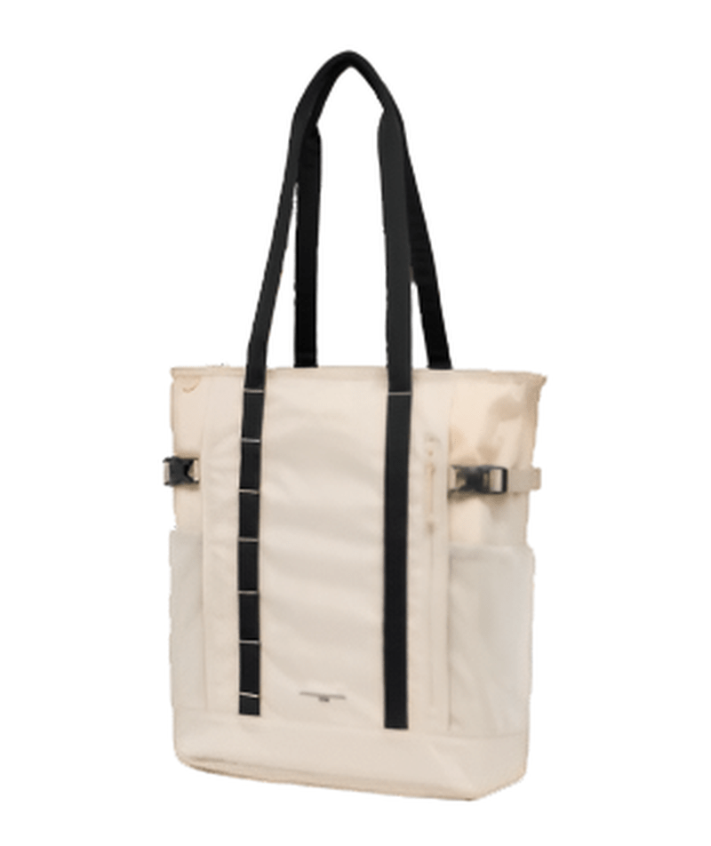 Sidovy av beige Tight Tote 25 axelväska som visar djup och justerbara spänne